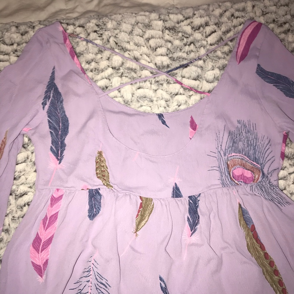 Cute purple top with feathers and dream catchers!